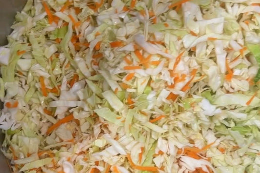 Freshly shredded cabbage and carrot prepared for Cabbage Mama sauerkraut fermentation.