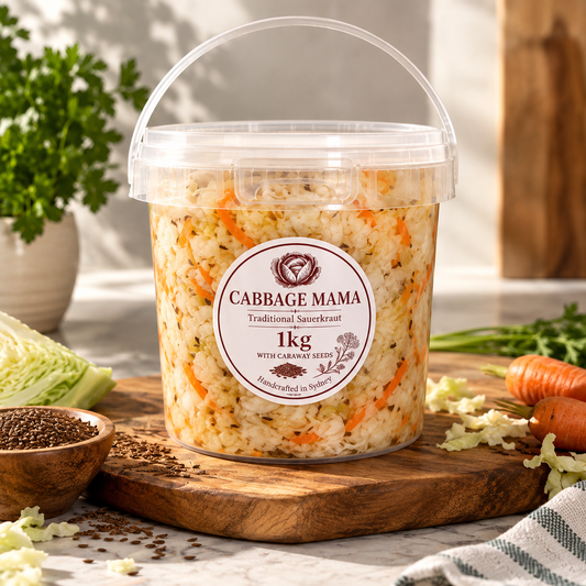 Cabbage Mama 1kg traditional sauerkraut with carrots and caraway seeds in a clear tub.